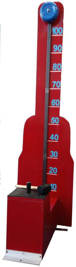 The game consists of a tall, red board, marked with numbers, and a blue bell at the top. At the base of the board there is a red box, with a button to hit, which sends a small piece of metal up the board towards the bell. There is a rubber mallet included, for striking the button.